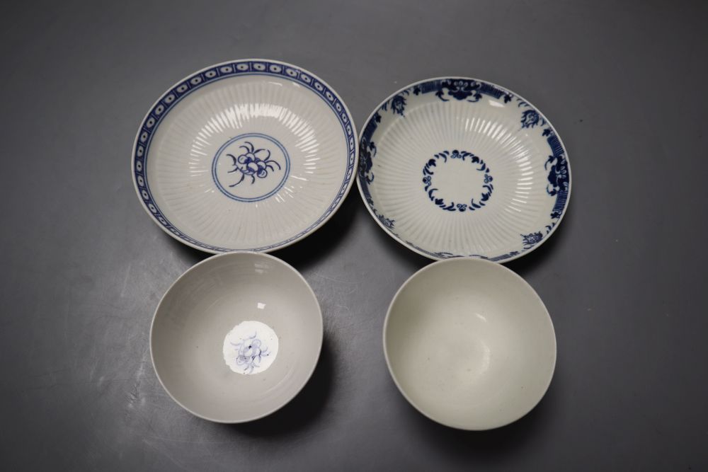 Two Worcester reeded teabowls and saucers, one with Dark Sprig Centre and the other with a border pattern, 12cm